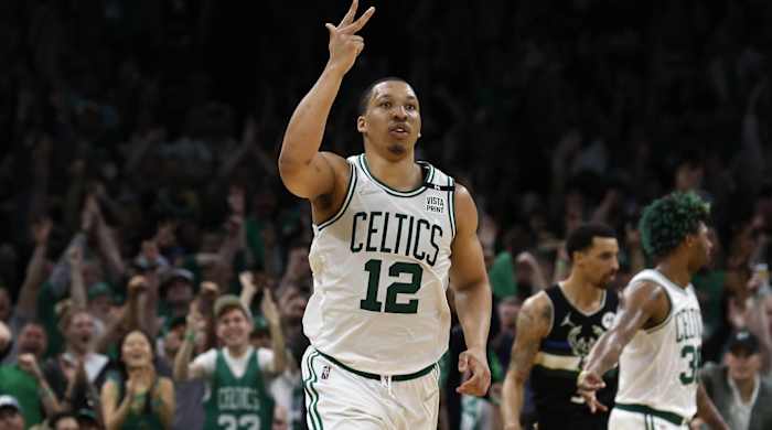 Grant Williams celebrates making a three-pointer vs. Milwaukee Bucks.